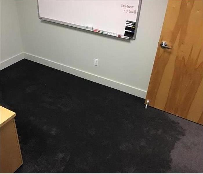 A Flooded office with very wet carpet